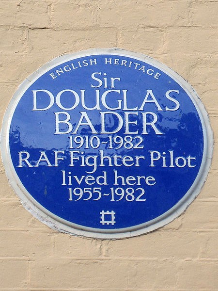 Image of blue plaque with the text Sir Douglas Bader 1910-1982 RAF Fighter Pilot lived here 1955-1982. Copyright Wikipedia Commons